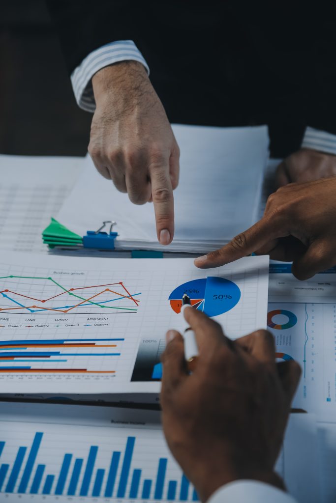 Business professionals reviewing financial charts and investment analysis